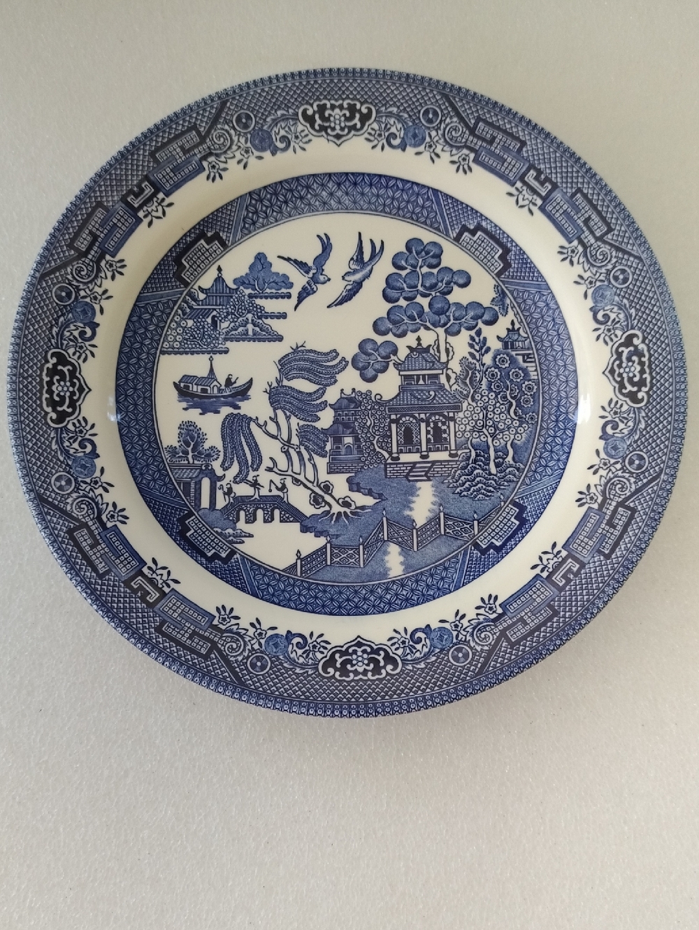 Churchill Blue Willow dinner plate in a blue and white Asian-inspired